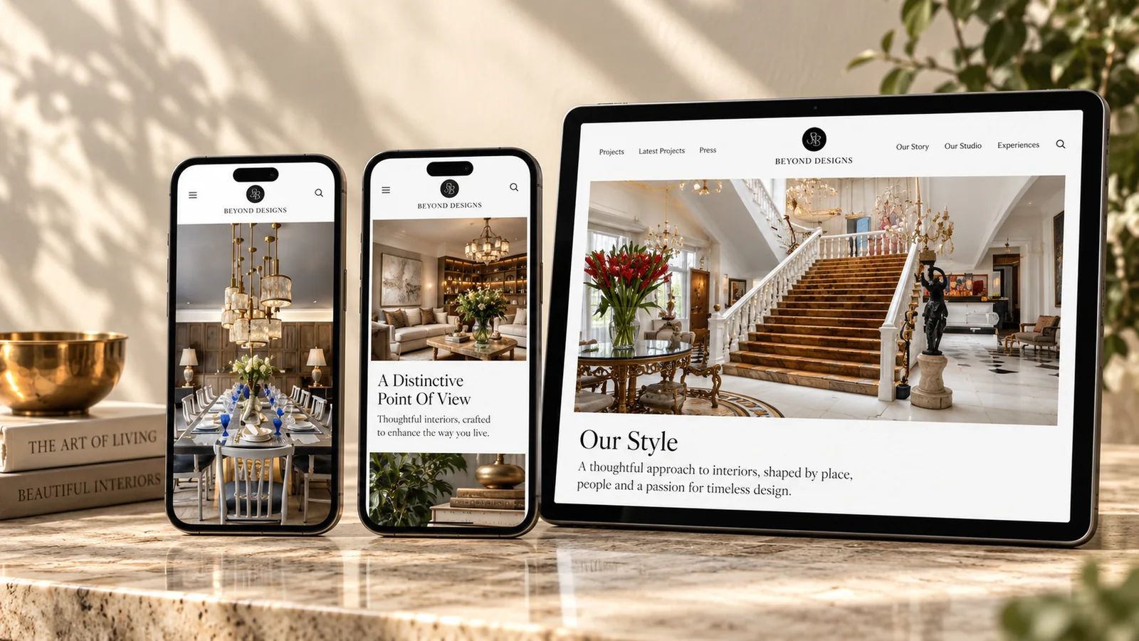 Beyond Designs responsive website on two phones and a tablet