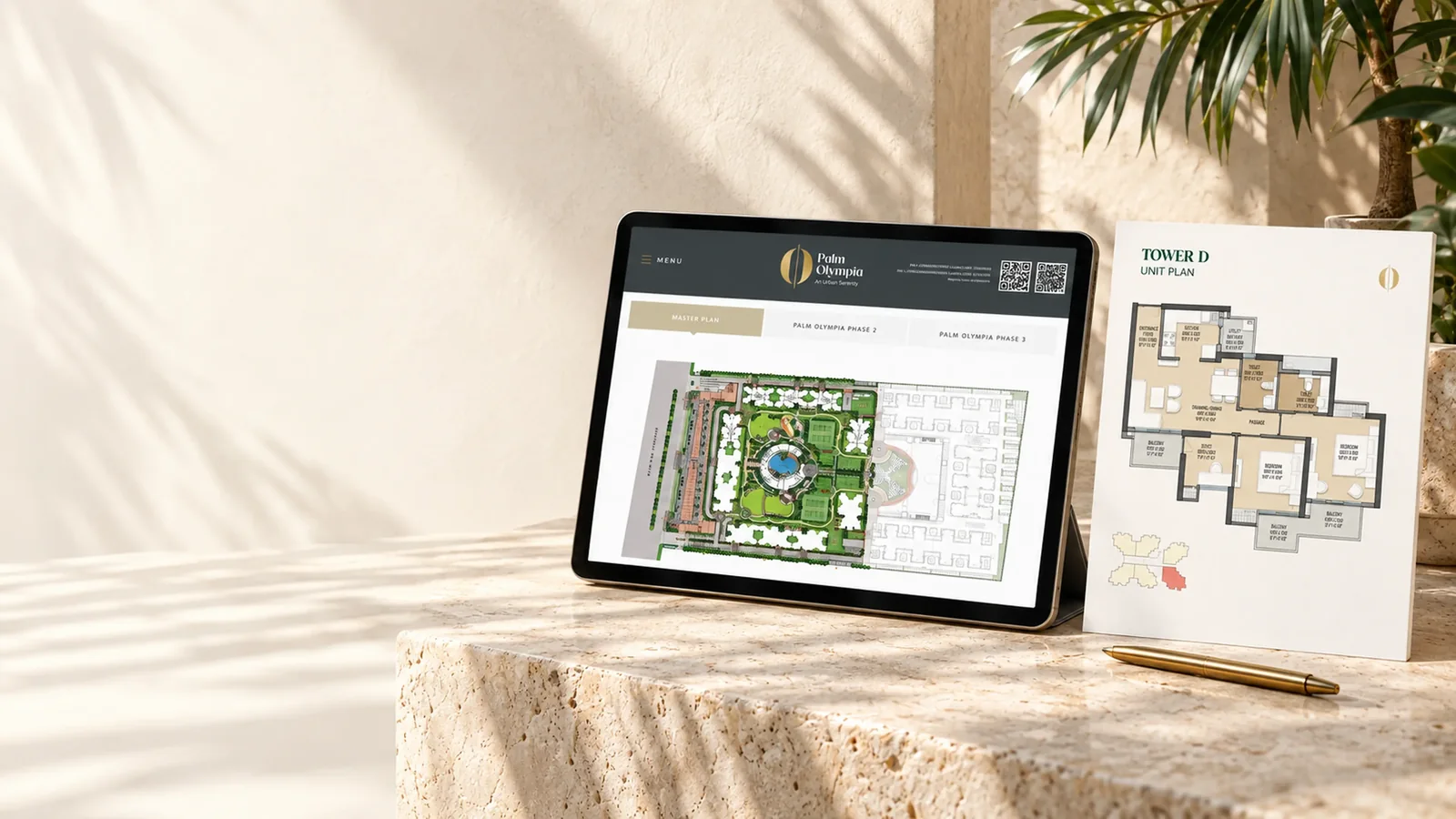 Palm Olympia master plan on a tablet next to a Tower D unit floor plan